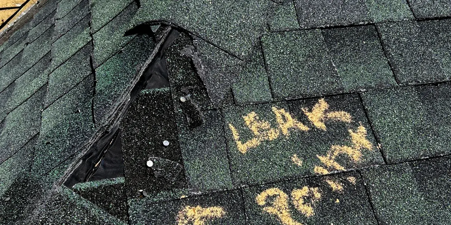Leak in Shingle Leak in the asphalt shingle valley; missing shingles and exposed nails.