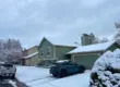 Residential home in Littleton, CO covered in fresh snow.