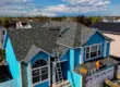 A professional roofer working on roof home in Littleton, CO.