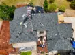 Aerial view of a residential roof replacement in progress on