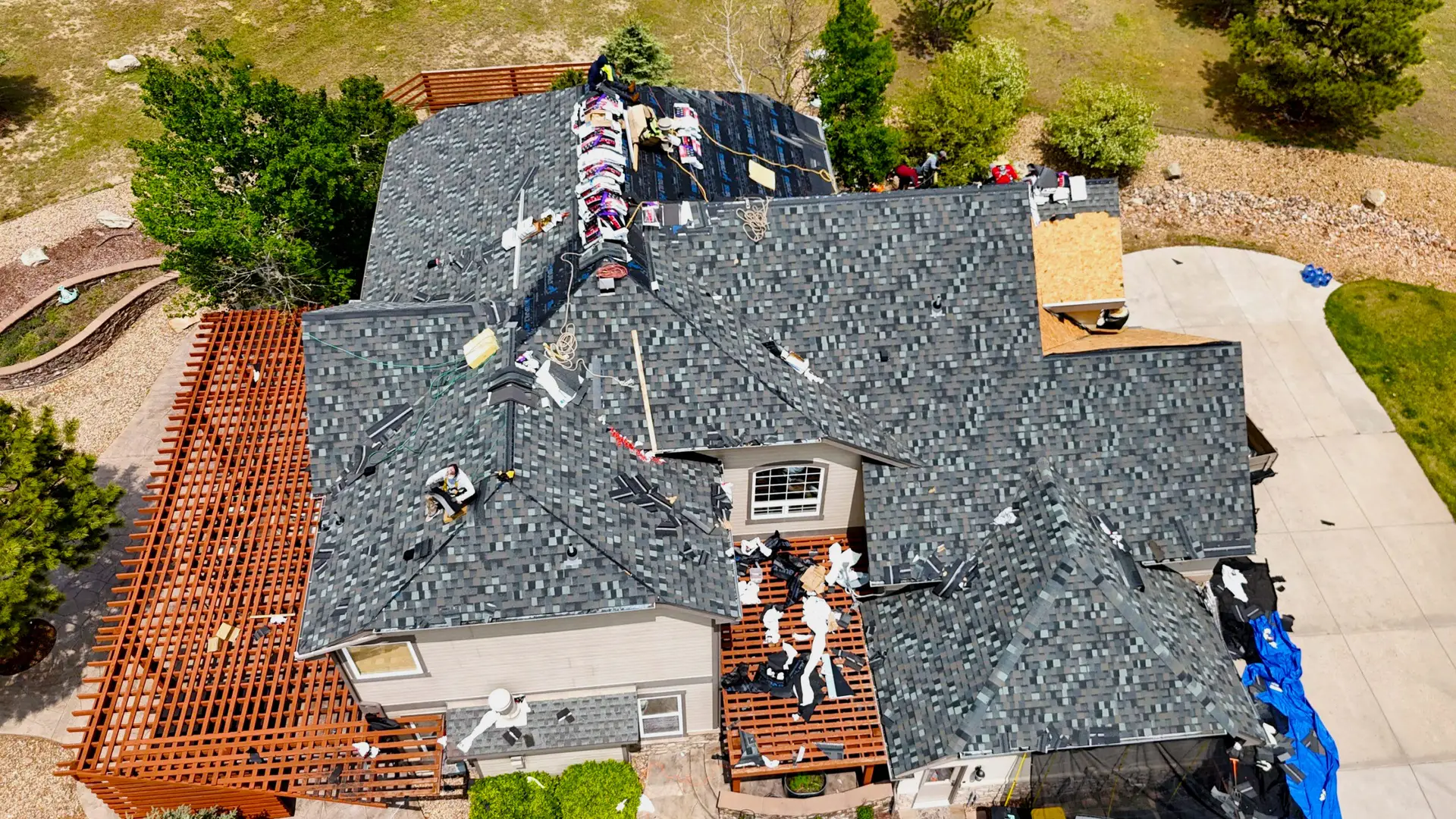 Aerial view of a residential roof replacement in progress on