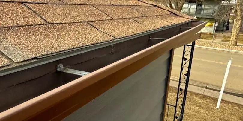 Newly Installed gutter Newly installed gutter along asphalt shingle roof of a home in Littleton, CO.