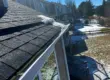 Roof in Littleton, CO showing melting snow along the shingles