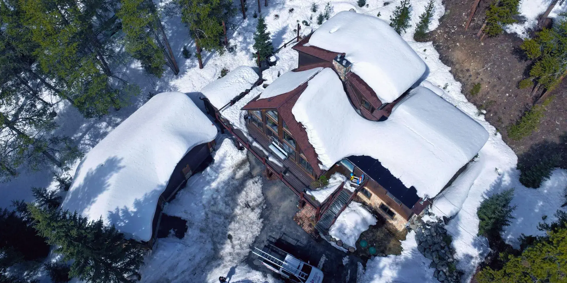 Snow-covered home Aerial view of a snow-covered mountain home