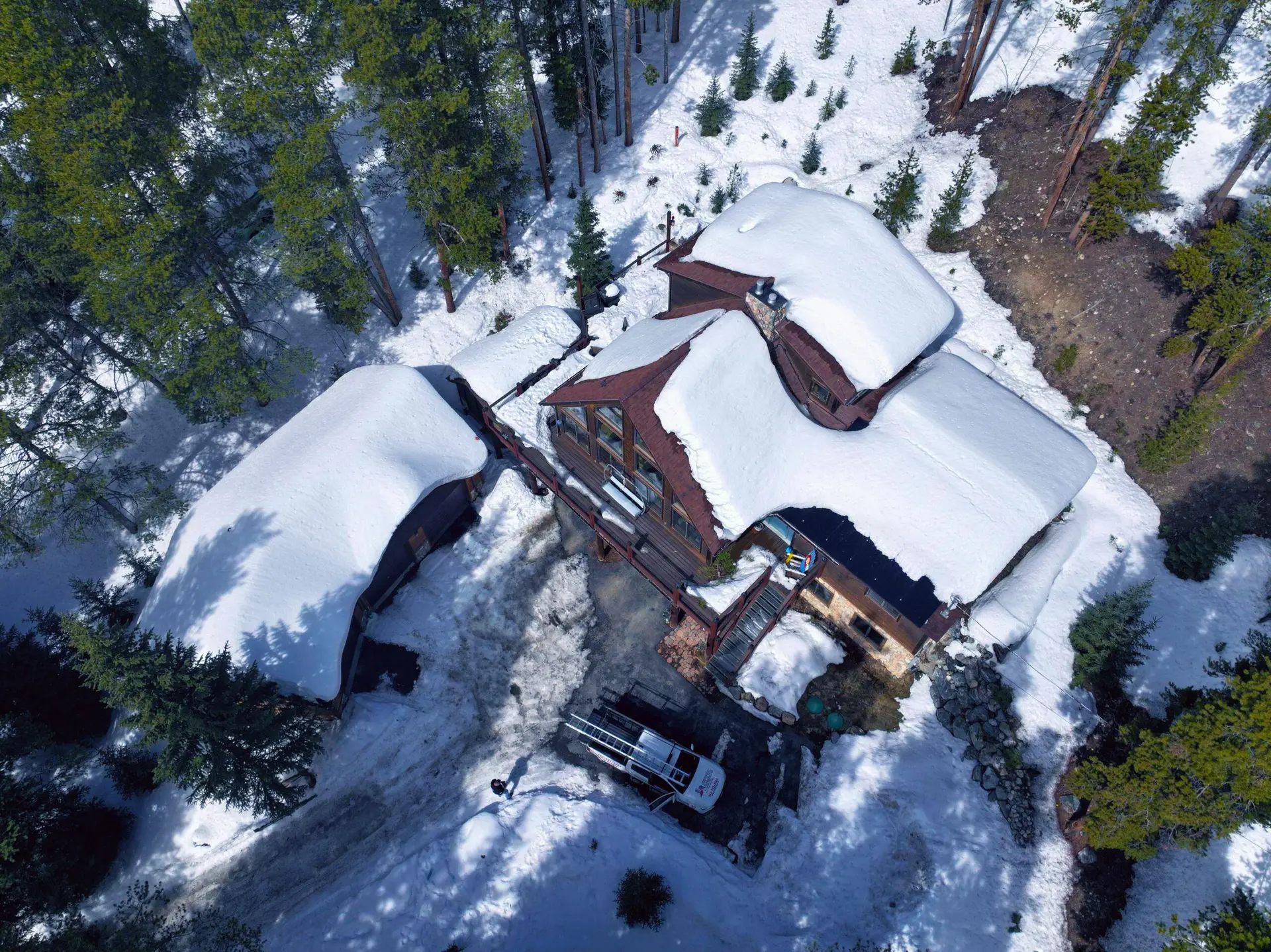 Aerial view of a snow-covered mountain home