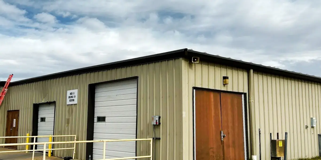Industrial warehouse with a metal roof Exterior of an industrial warehouse with a metal roof