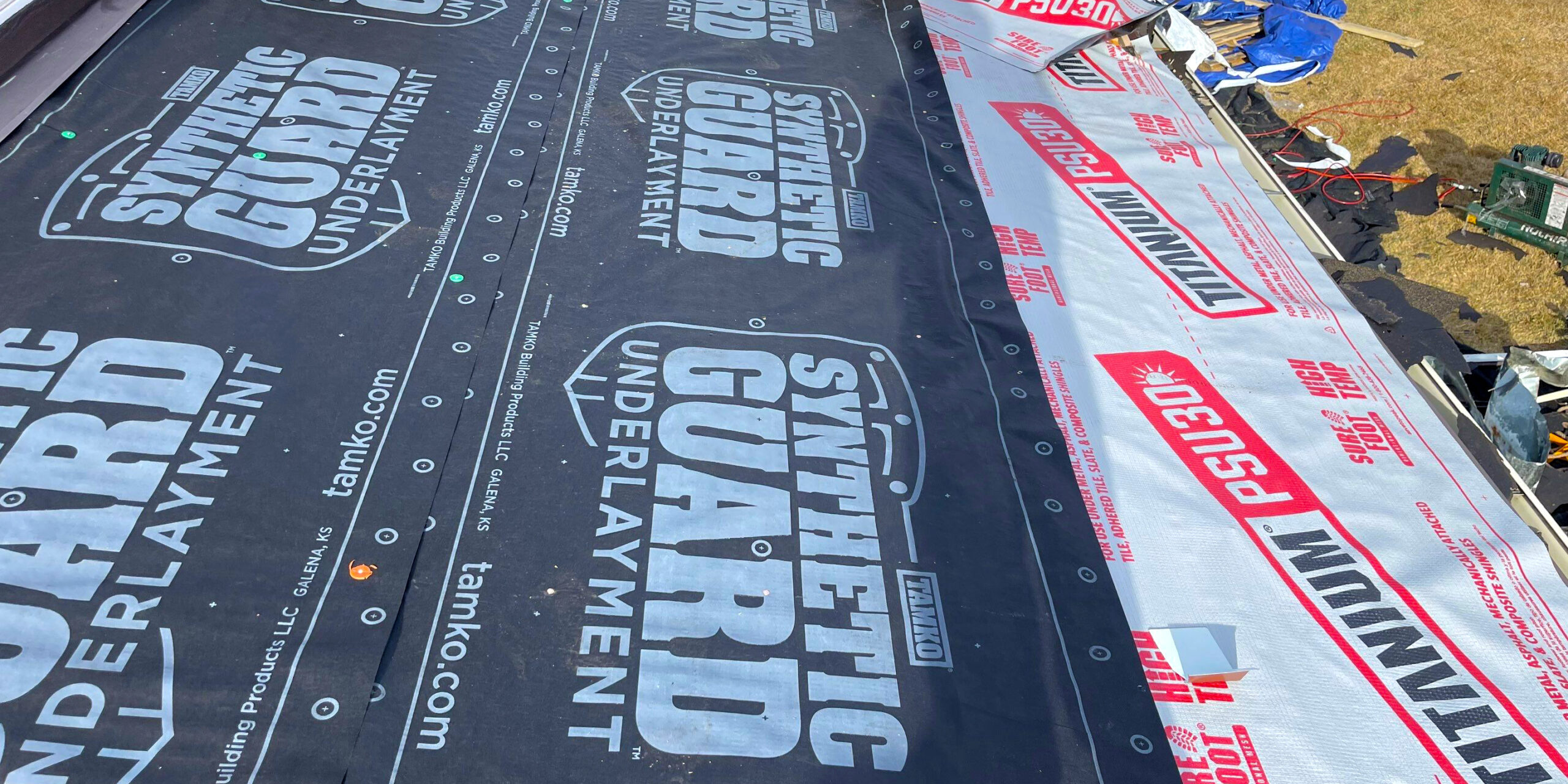 roofing underlayment Installation of synthetic roofing underlayment on a residential roof, showing protective layers applied before shingles to improve waterproofing and durability.