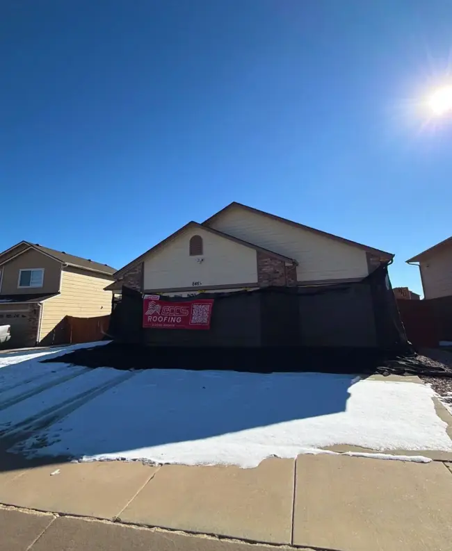 Qualified roofer Residential roof protected during a roofing project in Littleton, CO, highlighting the importance of hiring qualified roofers and asking the right questions before any installation or roof repair.