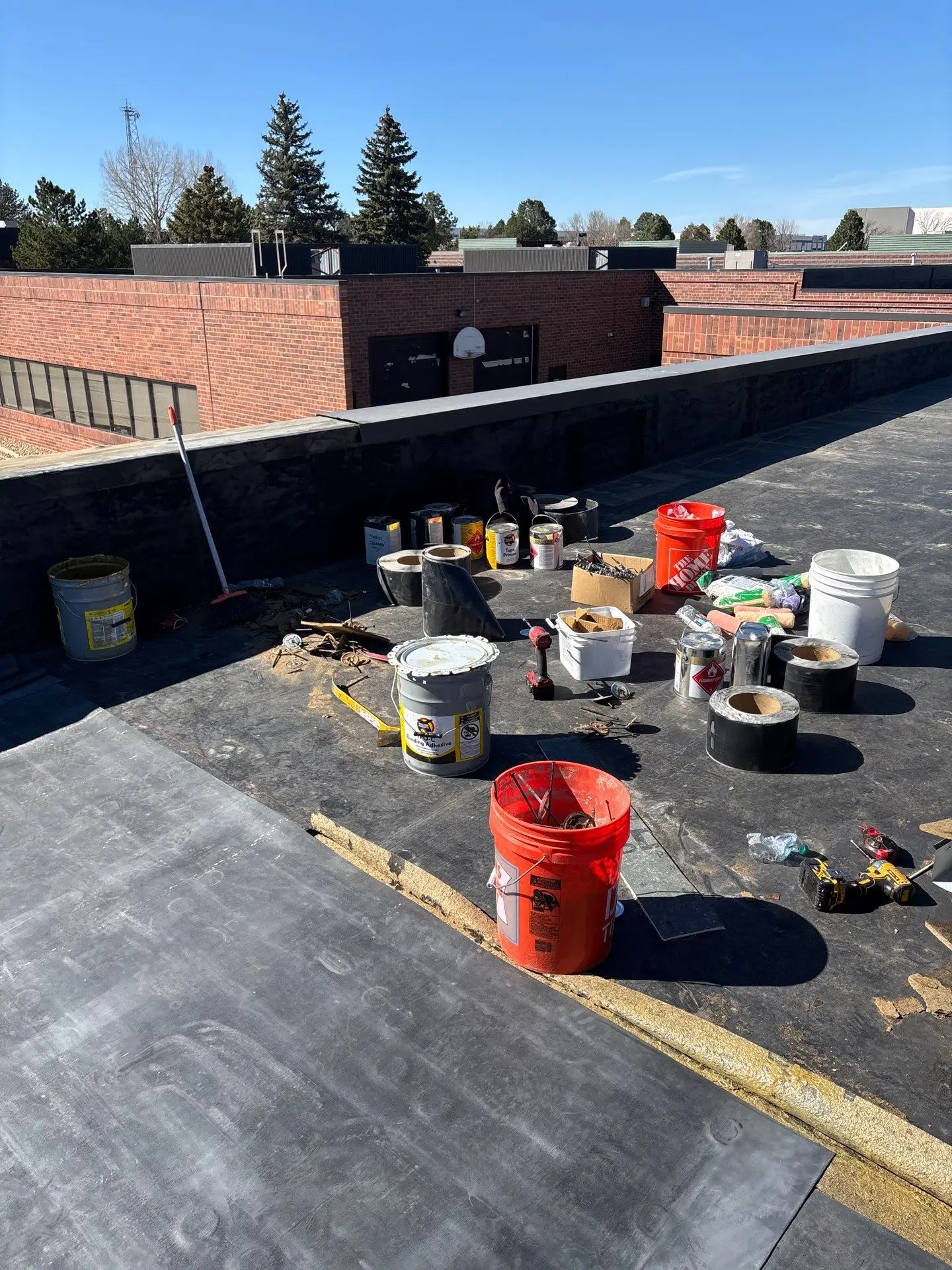 Flat roof repair work on a commercial building