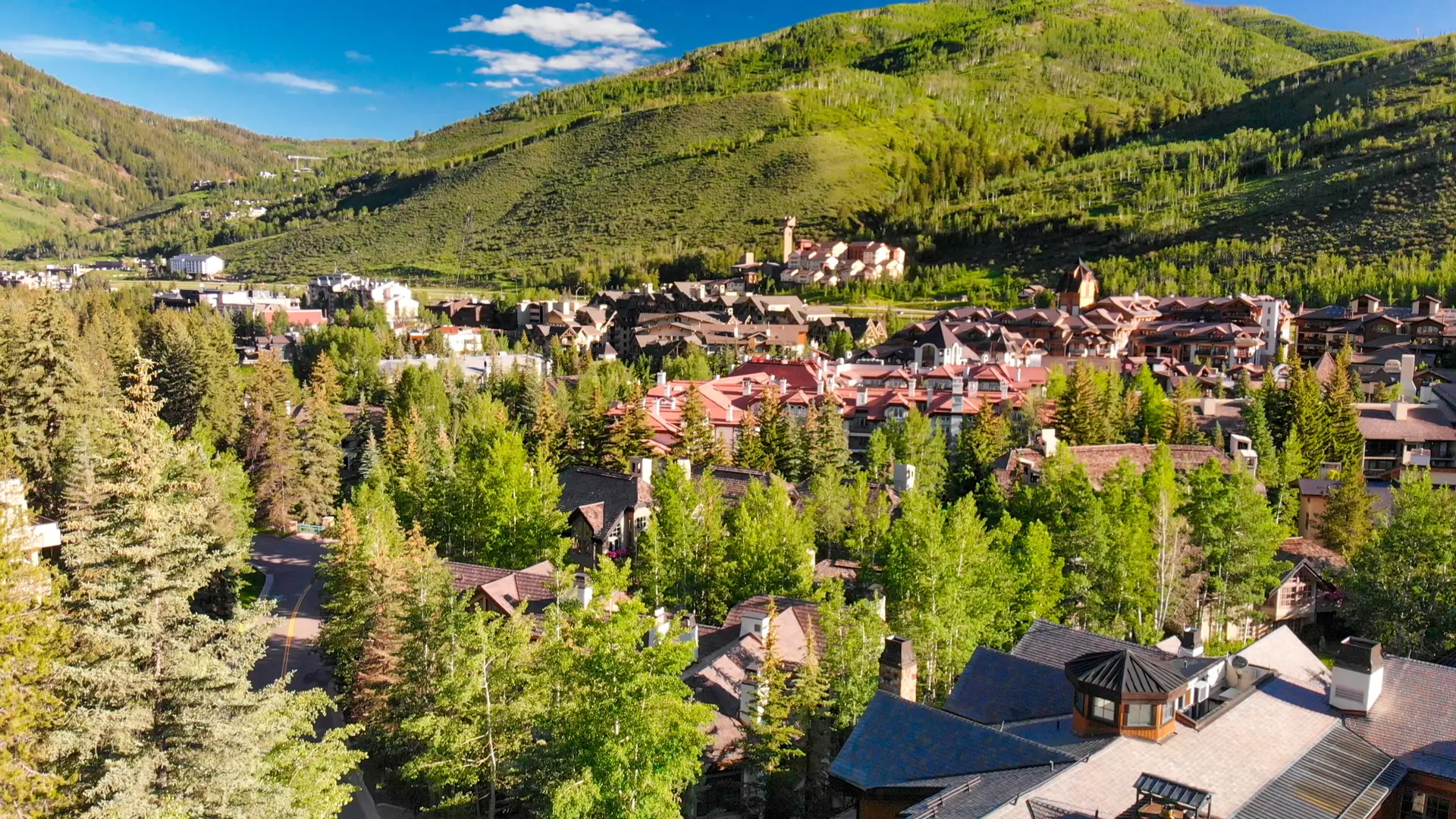 Vail Valley rooftops summer green mountains aerial