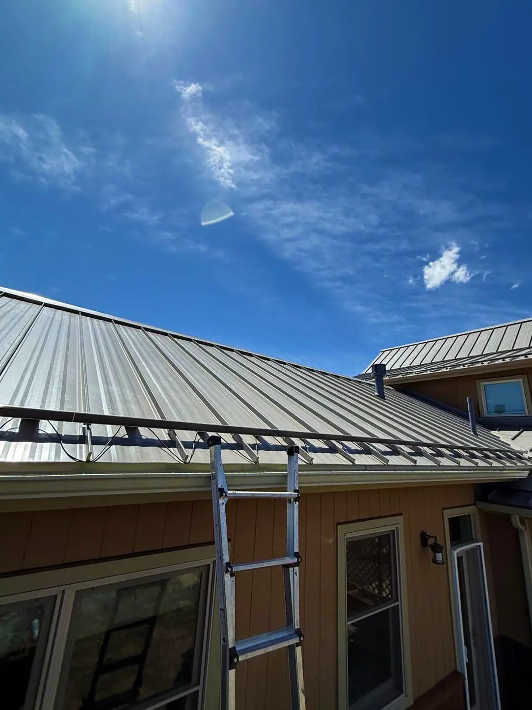 Wildfire prevention roof maintenance on a metal residential roof in Avon, Colorado